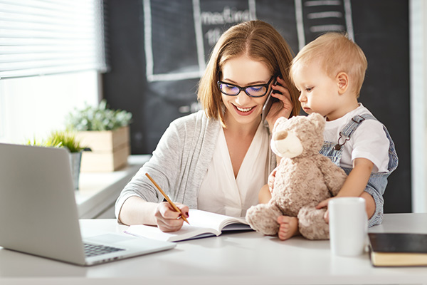 Young woman with a child starting a home-based business